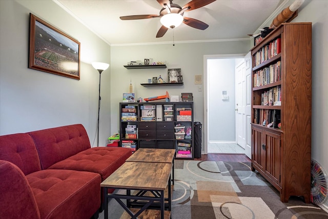 living room with dark hardwood / wood-style flooring, ornamental molding, and ceiling fan