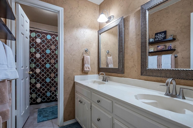 bathroom with tile patterned floors and vanity