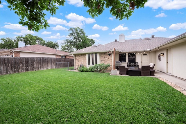 view of yard featuring an outdoor living space and a patio area