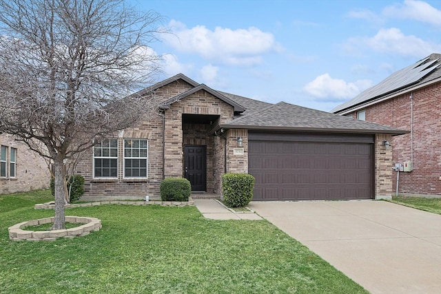 view of front facade with a garage and a front lawn