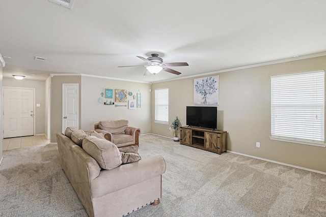 living room featuring light carpet, crown molding, and ceiling fan