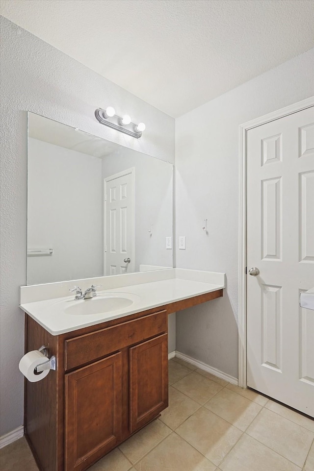 bathroom with vanity and tile patterned flooring