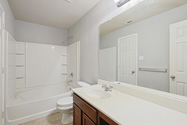 full bathroom featuring tile patterned floors, toilet, shower / washtub combination, and vanity