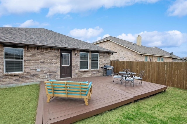 deck featuring area for grilling and a yard