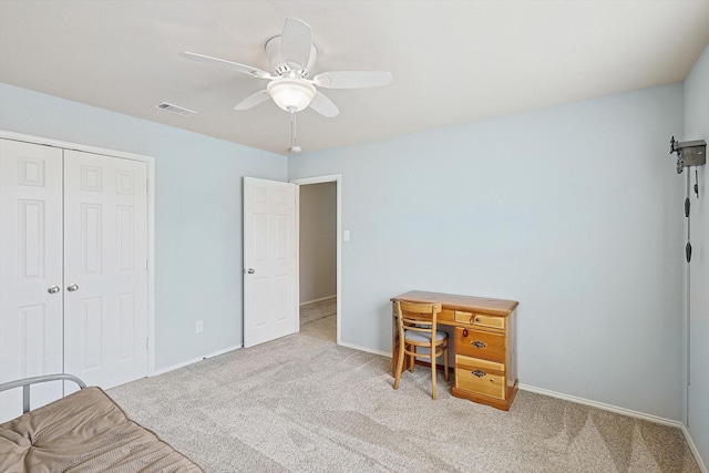 carpeted office with ceiling fan