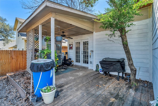 wooden terrace featuring a grill, french doors, and ceiling fan