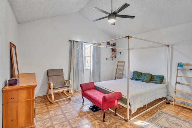 bedroom featuring ceiling fan, vaulted ceiling, a textured ceiling, and parquet flooring