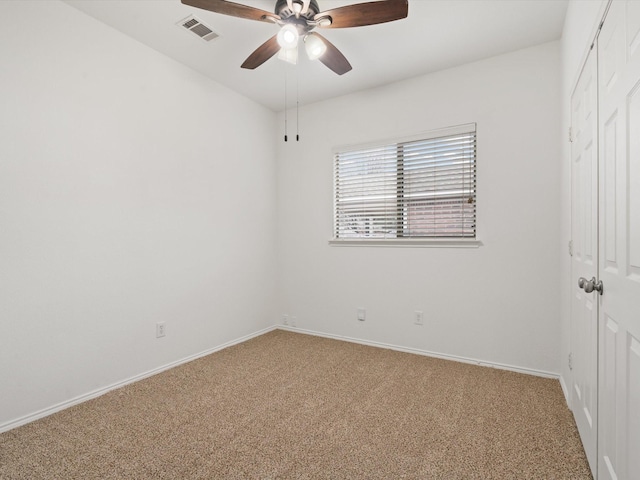 unfurnished bedroom featuring carpet floors, baseboards, visible vents, and a closet