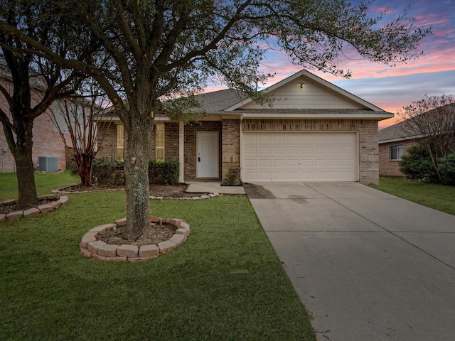 ranch-style home featuring driveway, central AC unit, an attached garage, a front lawn, and brick siding