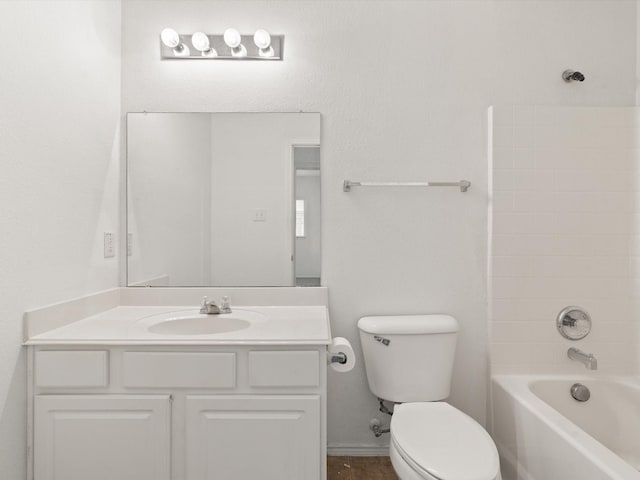 bathroom with shower / bathtub combination, vanity, and toilet