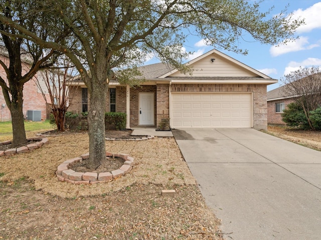 ranch-style house with a garage, concrete driveway, and brick siding