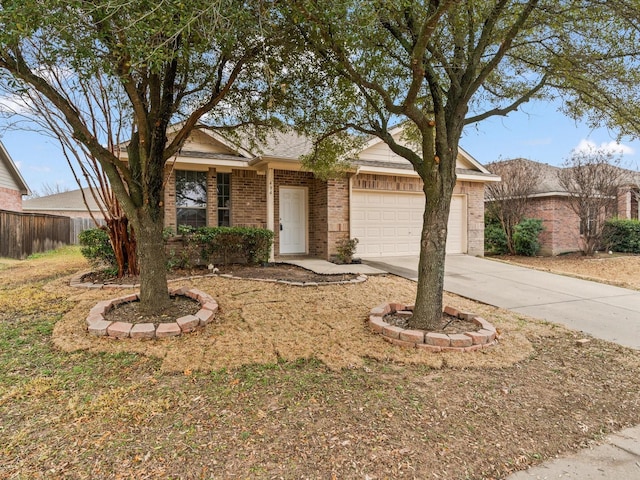 ranch-style house with concrete driveway, brick siding, fence, and an attached garage