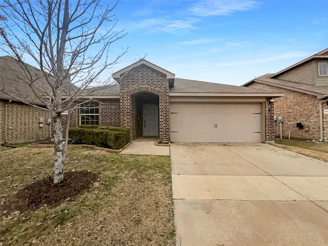 view of front of house featuring a garage and a front lawn