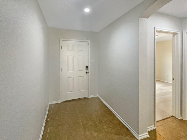 corridor featuring tile patterned floors