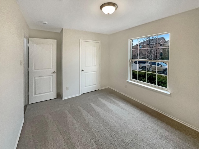 unfurnished bedroom with carpet flooring