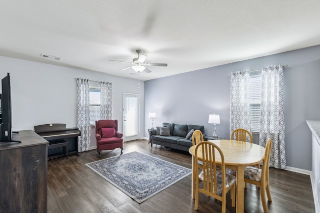 dining room featuring ceiling fan and dark hardwood / wood-style flooring