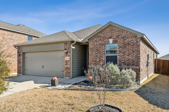 view of front of home with a garage and a front yard