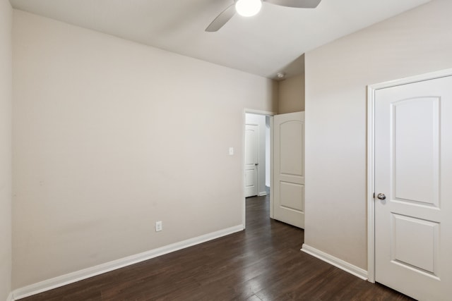 unfurnished bedroom with dark hardwood / wood-style flooring and ceiling fan