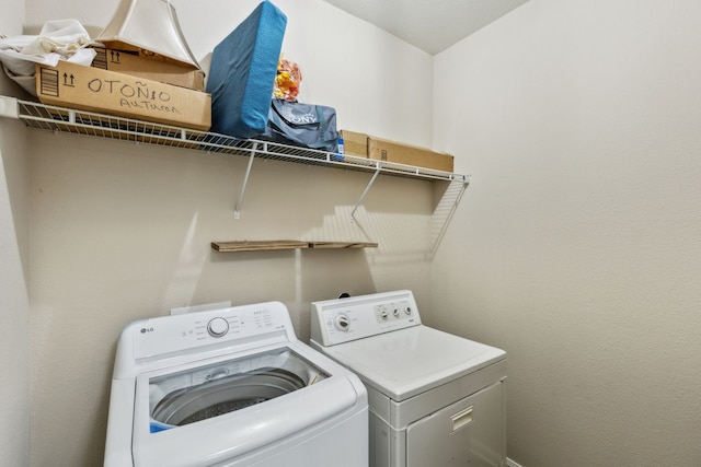 laundry area featuring independent washer and dryer