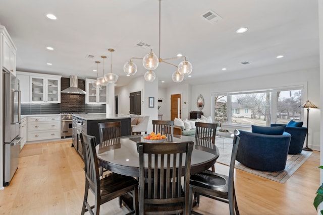 dining area with light wood-type flooring