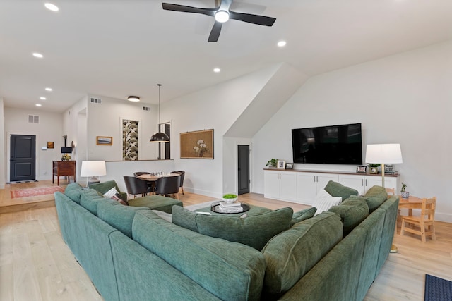 living room with ceiling fan and light hardwood / wood-style floors