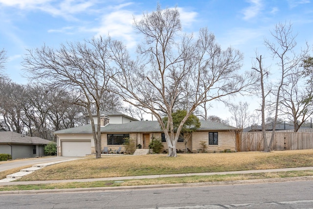 view of front of home with a garage and a front yard