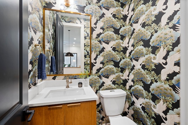 bathroom with vanity and toilet