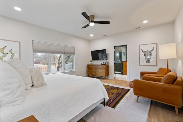 bedroom featuring ceiling fan and light hardwood / wood-style flooring