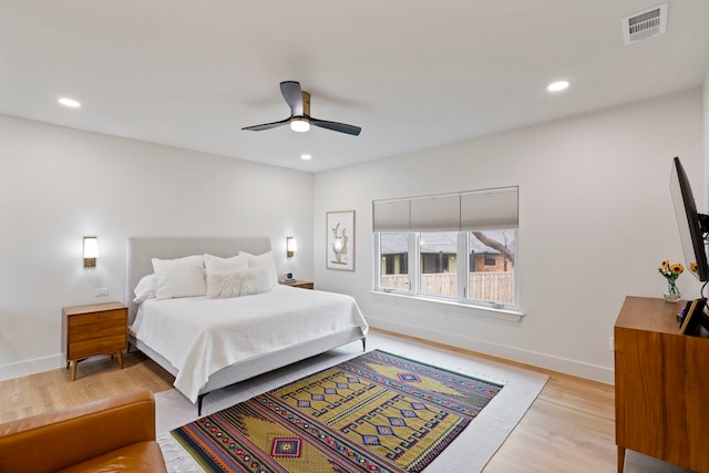 bedroom featuring ceiling fan and light hardwood / wood-style floors