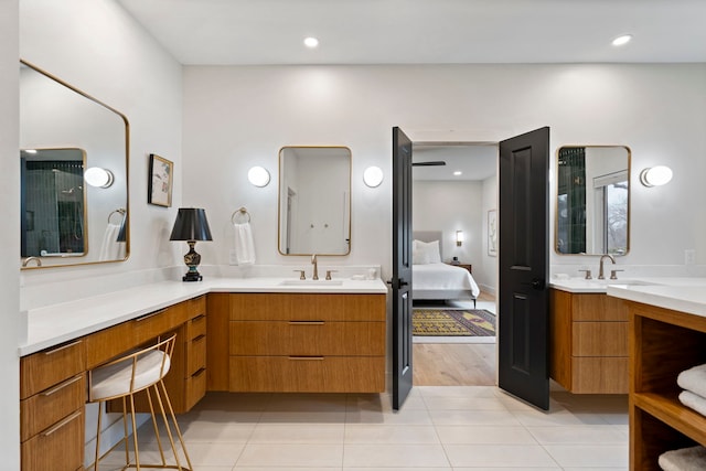 bathroom with tile patterned floors and vanity