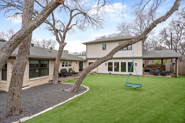 rear view of property with an outdoor hangout area, a patio area, and a lawn