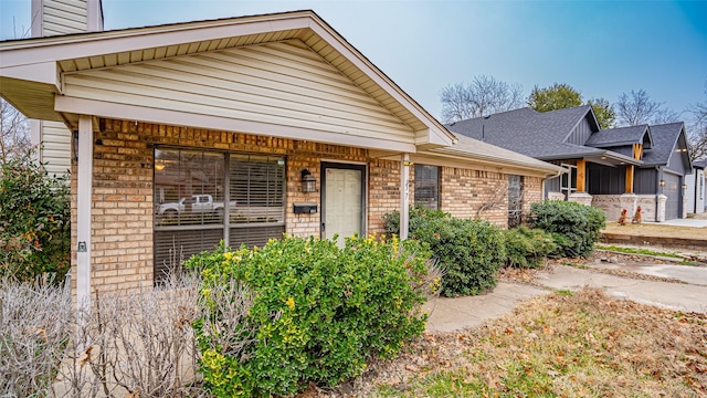 view of front of house with brick siding