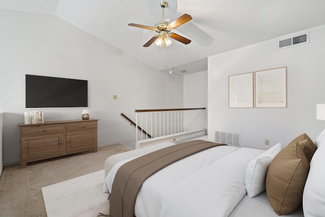 bedroom with light carpet, vaulted ceiling, and ceiling fan