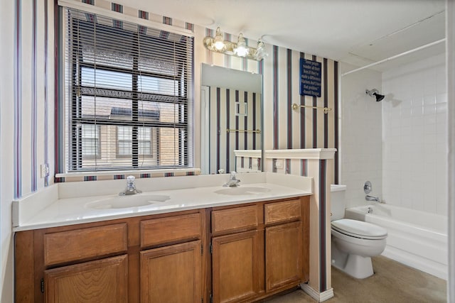 full bathroom with vanity, toilet, and tiled shower / bath combo