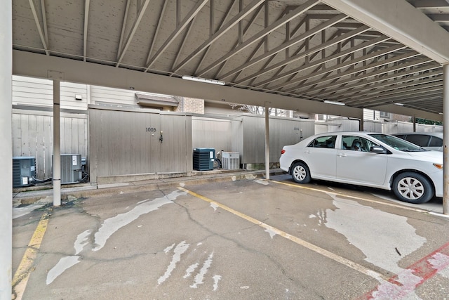 view of vehicle parking with a carport