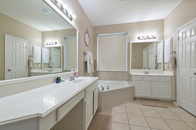 bathroom featuring tile patterned floors, plus walk in shower, and vanity