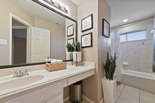 bathroom with shower / tub combo with curtain, vanity, and tile patterned floors