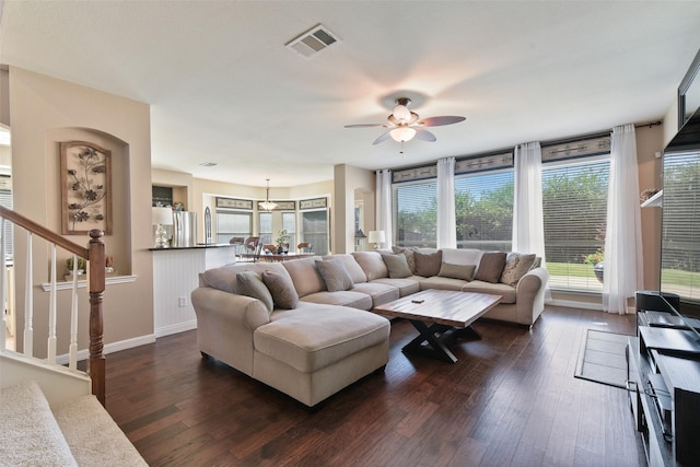 living room with dark hardwood / wood-style floors and ceiling fan