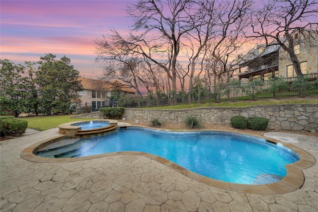 view of pool at dusk