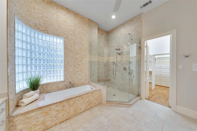 bathroom with ceiling fan, vanity, and independent shower and bath