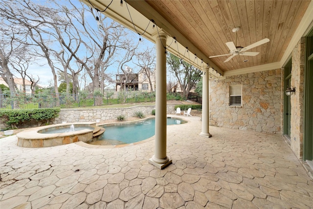 view of swimming pool with a patio, ceiling fan, and an in ground hot tub