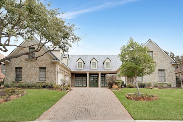 view of front facade with a garage and a front lawn