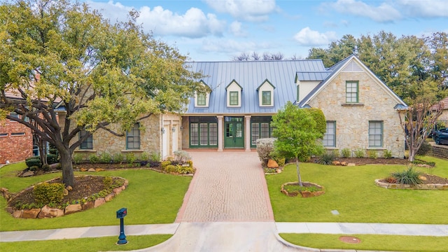 view of front facade featuring french doors and a front lawn