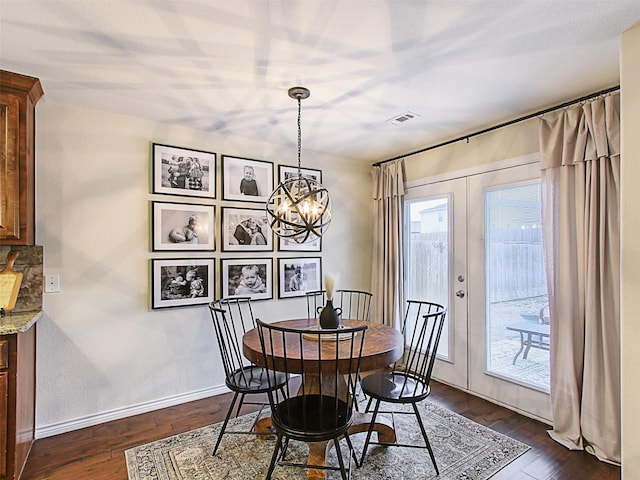 dining space with french doors and dark hardwood / wood-style floors