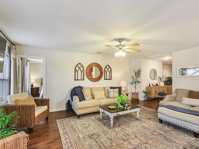 living room featuring ceiling fan and dark hardwood / wood-style flooring