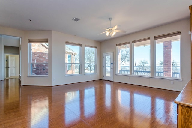 unfurnished room featuring hardwood / wood-style flooring and ceiling fan