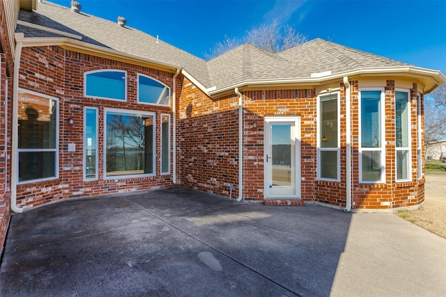 entrance to property with a patio area