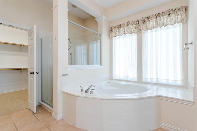 bathroom featuring tile patterned floors and plus walk in shower