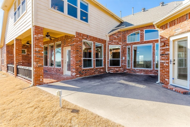 exterior space featuring ceiling fan