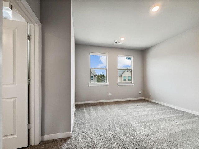 unfurnished room featuring carpet flooring